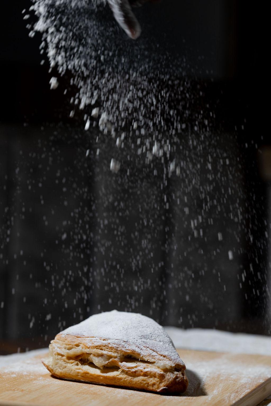Flour dusting down over the work surface at Jessy Bread
